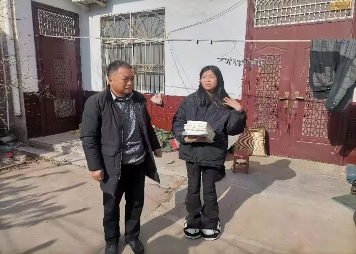 張建平：愛心助困，情滿寒冬